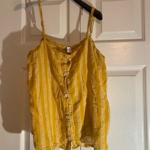 A mustard yellow spaghetti strapped shirt.